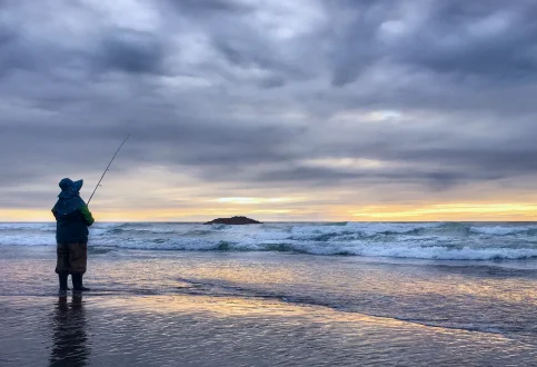 silhouette-man-fishing-beach-sunset 1